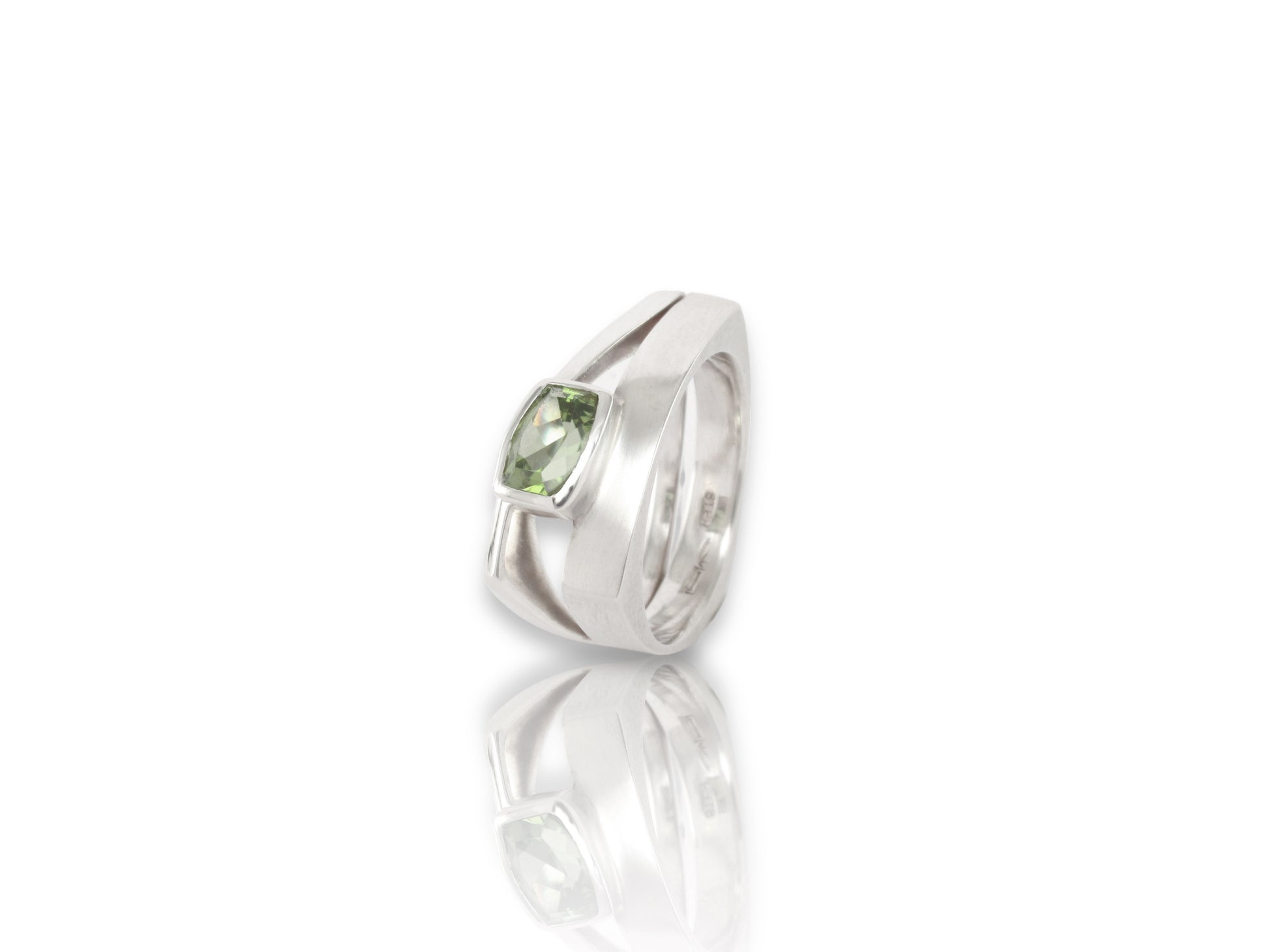 Sterling silver triangle ring, double band with flow and negative space for a bold light look and feel, with a bezel set rectangle facetted peridot, by ZEALmetal, Nicole Horlor, in Kingston, ON, Canada 